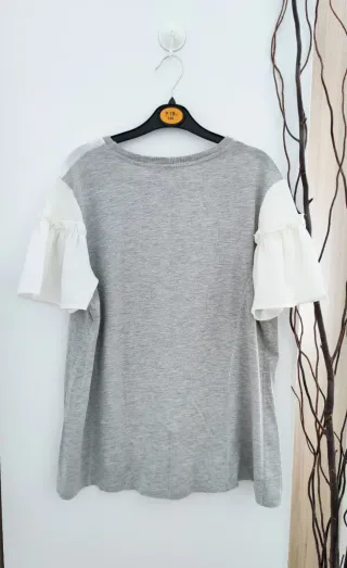 Bonita camiseta manga volante en L 40