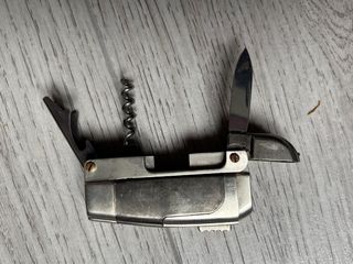 Coltellino svizzero con accendino antivento