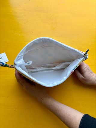 pochette con cinturino da polso motivo floreale