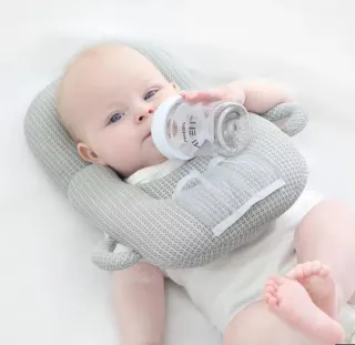 Almohada para bebé biberones