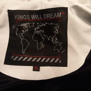 Abrigo plumífero blanco y negro