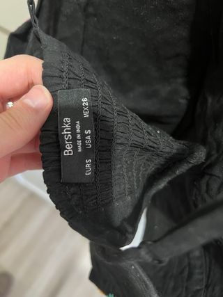 Top negro con adornos