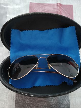 Gafas de sol polarizadas doradas y negras