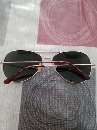 Gafas de sol polarizadas doradas y negras