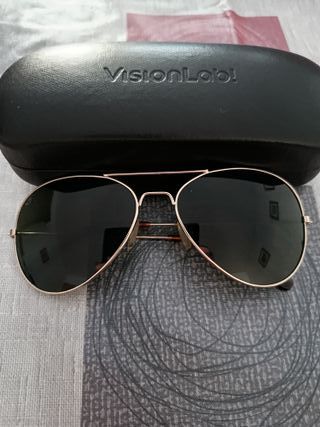 Gafas de sol polarizadas doradas y negras