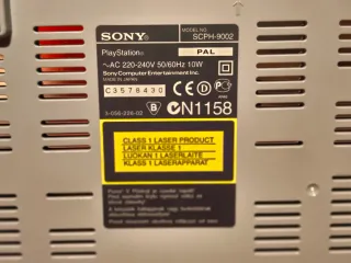 Consola PS1 gris con mando y 2 tarjetas memoria