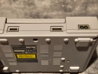 Consola PS1 gris con mando y 2 tarjetas memoria