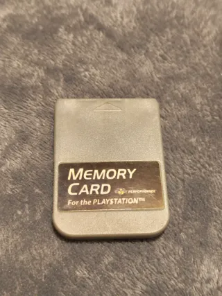 Consola PS1 gris con mando y 2 tarjetas memoria