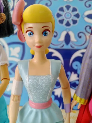 Tre bambole Disney: Toy Story, Wish, Fei Fei