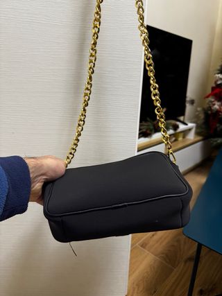 Borsa Paola Tienforti nera con dettagli oro