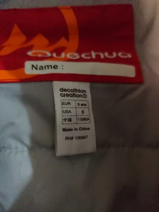 Mono de nieve infantil rojo y azul