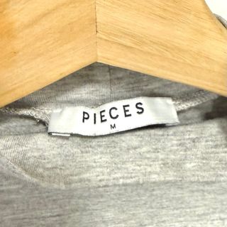 Talla M - Camiseta gris con volantes