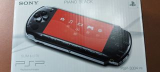 PSP Negra con Batería, cargador y 4 juegos