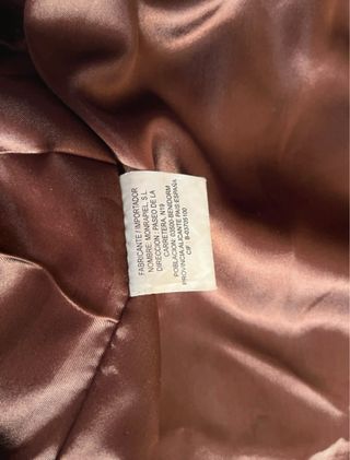 Abrigo de piel marrón hombre.