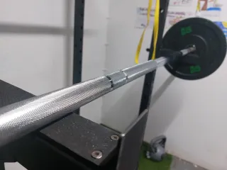 Barra Olímpica con discos