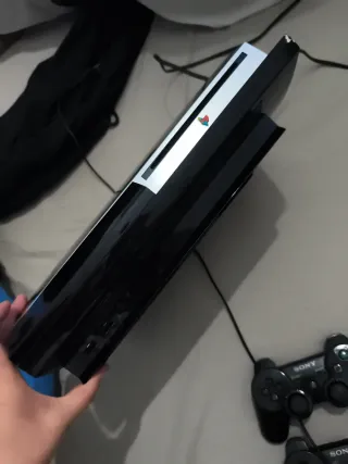 Consola PlayStation 3 con 4 mandos y juegos