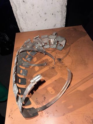 Protector de escape metálico