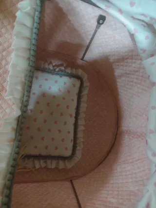 Cochecito de juguete rosa