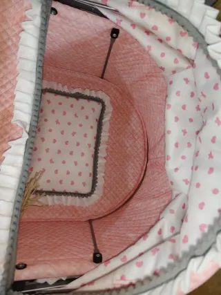 Cochecito de juguete rosa