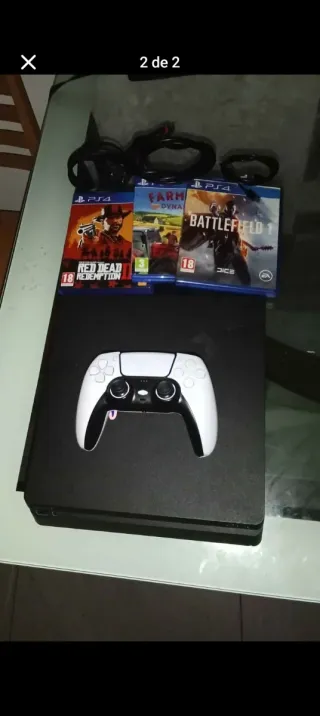 Consola PS4 con mando y juegos