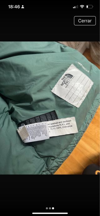 Plumífero The North Face verde y negro.