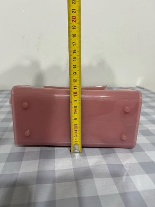 Borsetta trasparente in gomma rosa con scritte