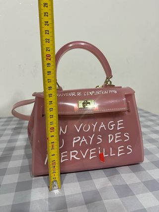 Borsetta trasparente in gomma rosa con scritte