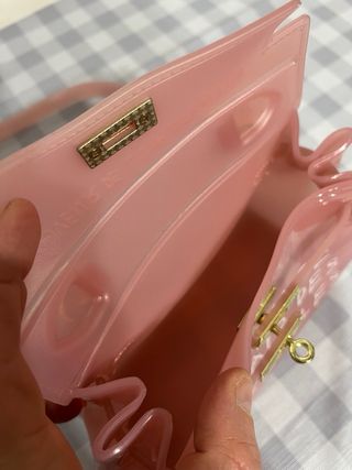 Borsetta trasparente in gomma rosa con scritte