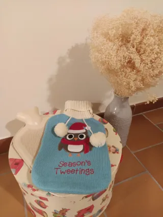 Bolsa de agua caliente con funda de punto.