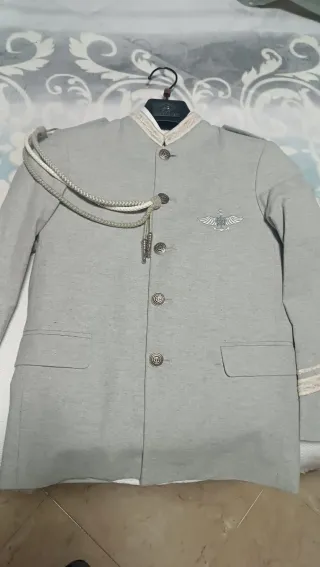 Traje de comunión niño gris,marca Busstop,talla 9