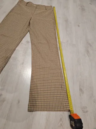 Pantaloni a quadri beige e marroni