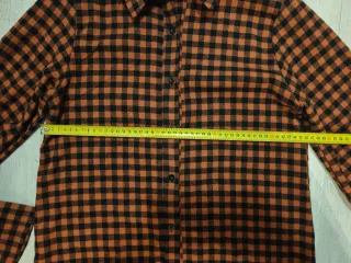 Camiciona a quadri arancione e nera