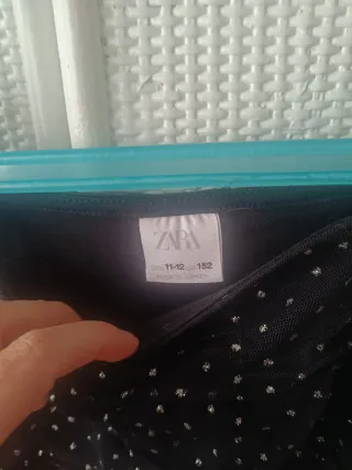 Blusa fiesta negra topos plata mangas transparente