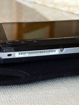 PSP 1004 Negra + 4 Juegos