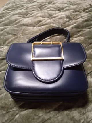 Bolso azul y dorado estilo años 60