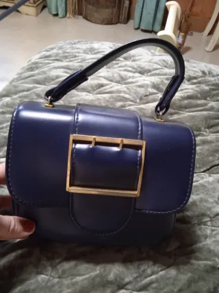 Bolso azul y dorado estilo años 60