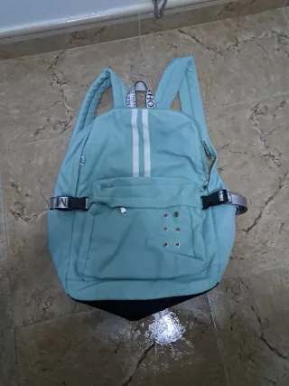 Mochila juvenil plateada y turquesa