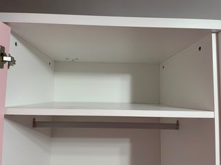 Cama abatible rosa y blanca