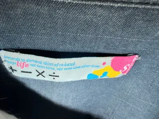 Mono vaquero con cremallera y abalorios