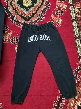 Tuta uomo nera con scritte