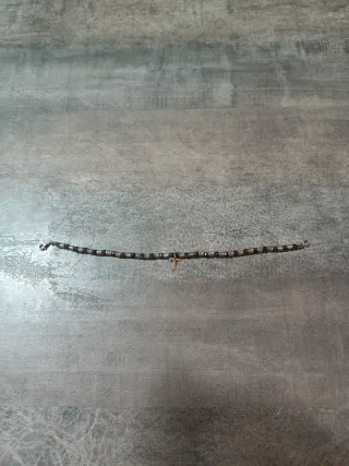 Pulsera  de plata hematites facetados con una cruz