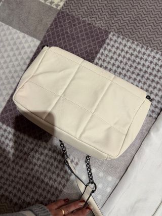 Mala tiracolo acolchoada