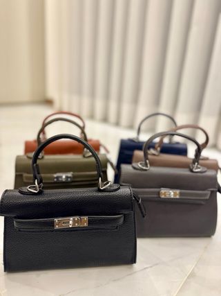 Mala de mão com alça tiracolo