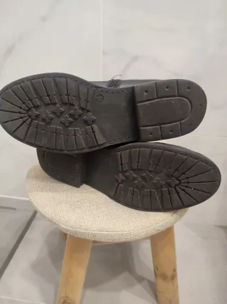 Stivali neri in vera pelle con fibbie