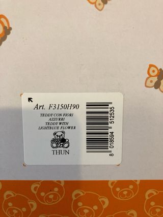 Orsetto Teddy Thun con fiori azzurri e farfalla