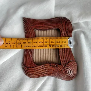 Piccola cornice in legno intagliato