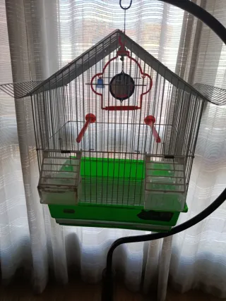 Jaula para pájaros con brazo colgador