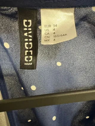 Mono azul oscuro con lunares blancos