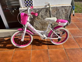 Bicicleta infantil rosa y blanca