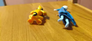 Figuras Frozen y Pluto.